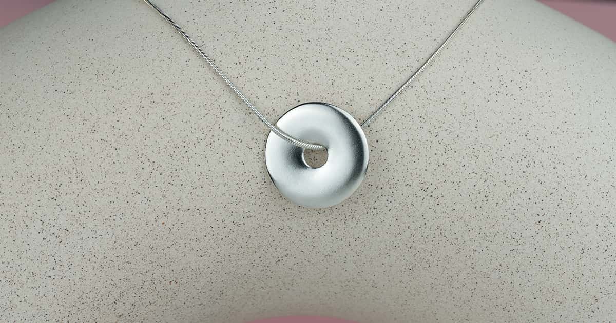 Silver necklace with a large silver pendant